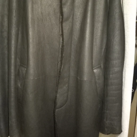 Medium DKNY 3/4 length lambskin shearling.